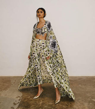 Silk chiffon cape with fitted pants and floral patch crop top
