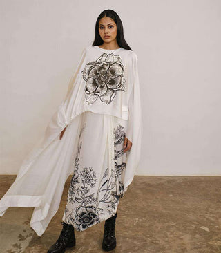 Asymmetrical cape style silk top with draped printed silk skirt