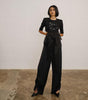 Cropped top with embellished patch and silk trousers